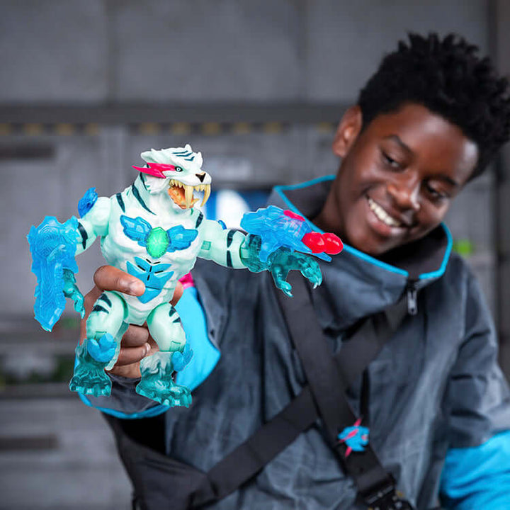 Child smiling and holding MrBeast Lab Cryo Lab action figure with icy blue and white details, capturing excitement and wonder.