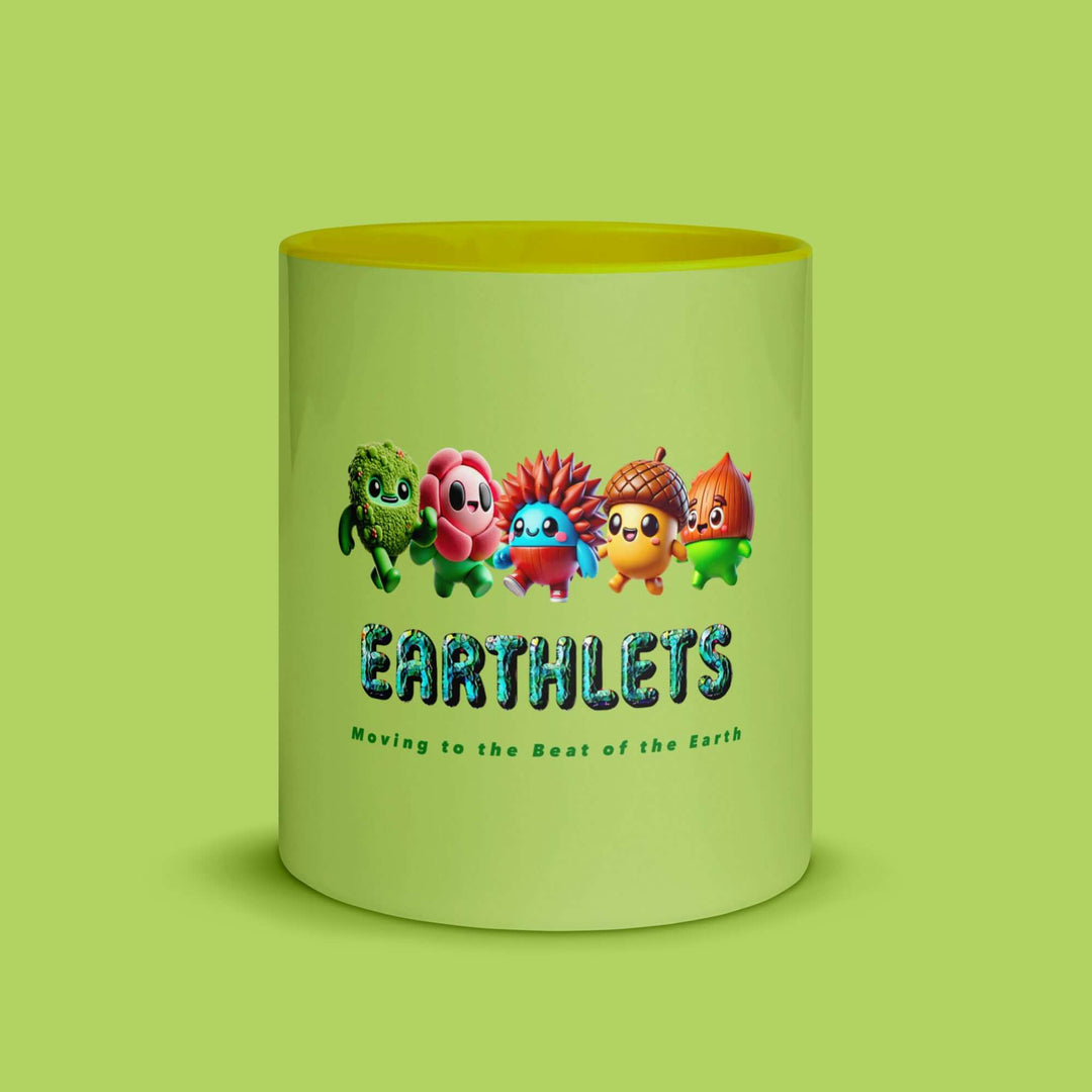 Colorful Earthlets mug featuring playful characters and a vibrant yellow inside, perfect for coffee or tea.