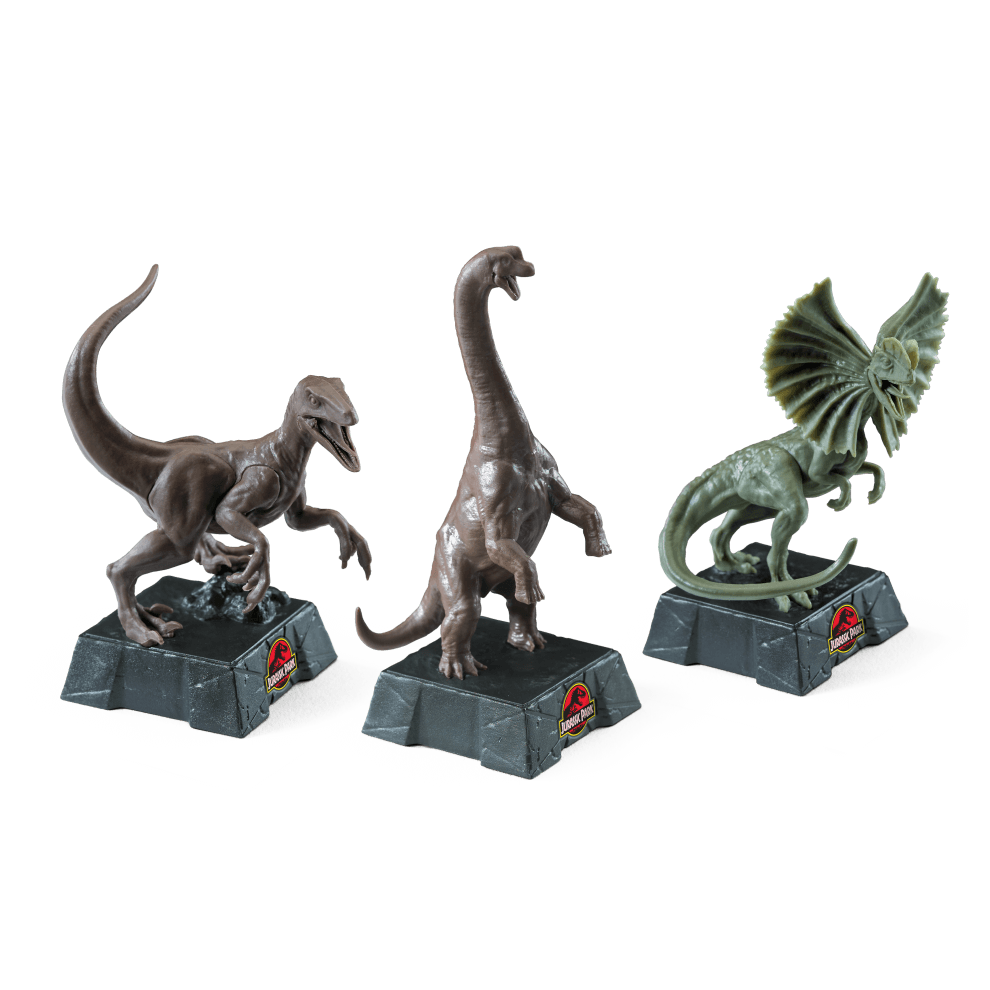 Jurassic Park Chess Set featuring detailed dinosaur pieces including Velociraptor, Brachiosaurus, and Dilophosaurus.