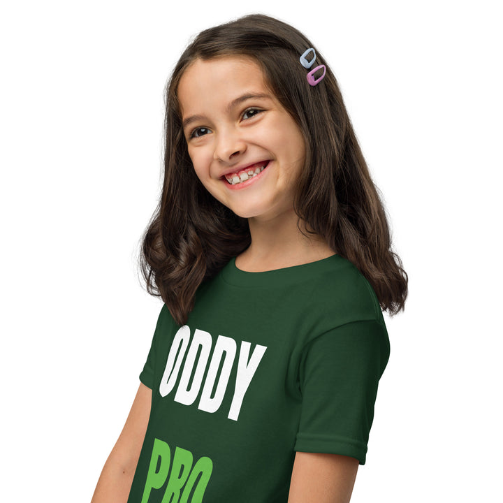 Happy girl wearing an Oddy Pro Youth t-shirt in green, showcasing its modern fit and style.