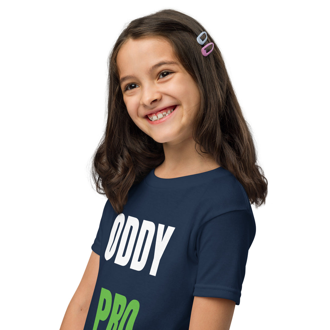 A smiling girl wearing an Oddy Pro Youth t-shirt in navy, showcasing comfort and style for active kids.