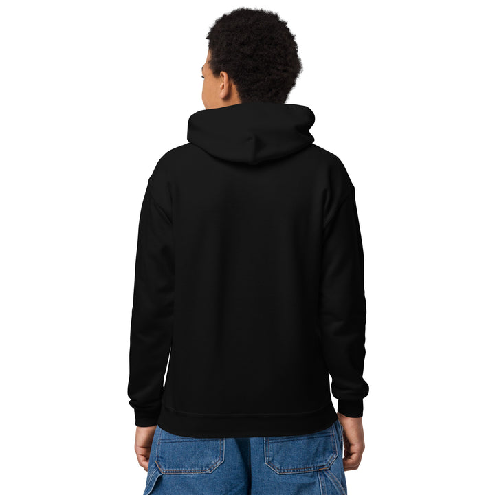 Back view of a person wearing the Oddy Pro Youth heavy blend hoodie in black.